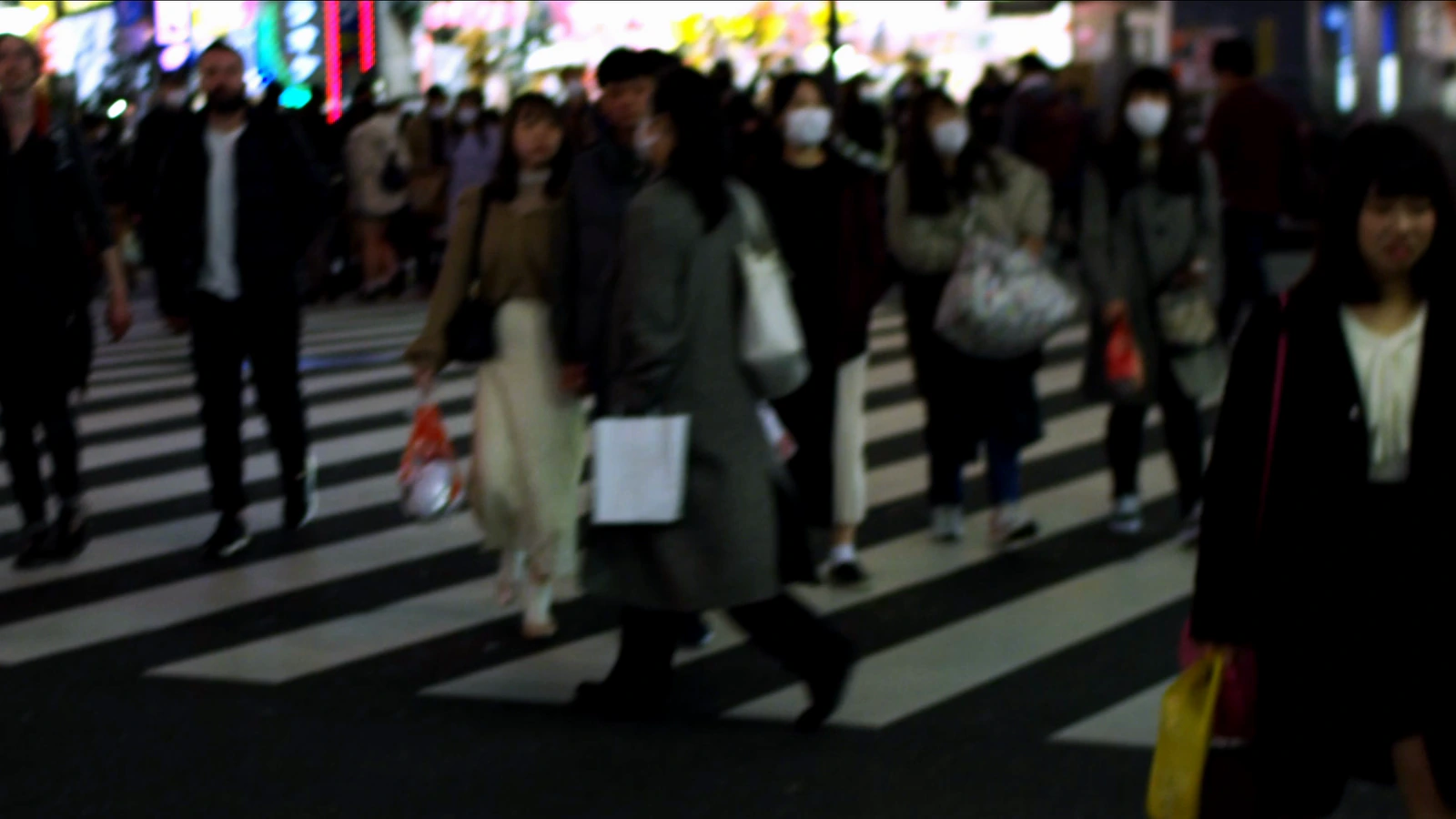 A crowded crossing in Tokyo at night