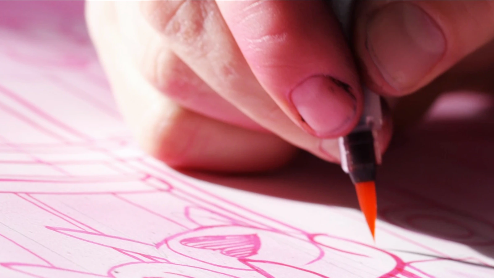 A brush drawing on pink paper