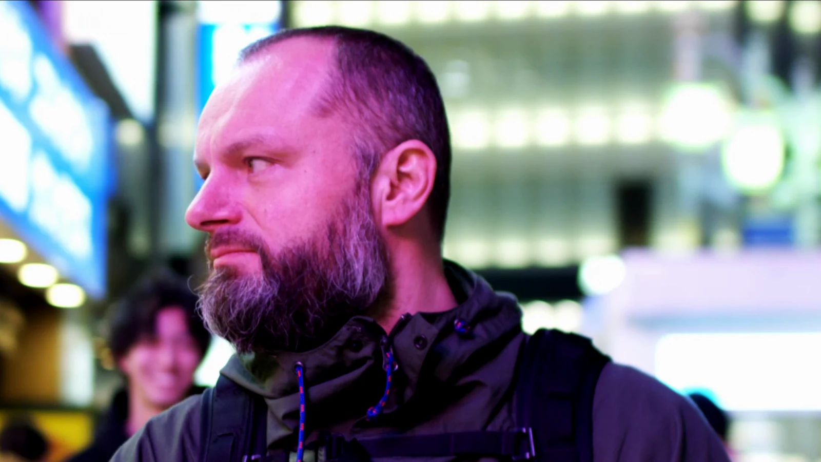 Erik in a neon-lit Tokyo street at night
