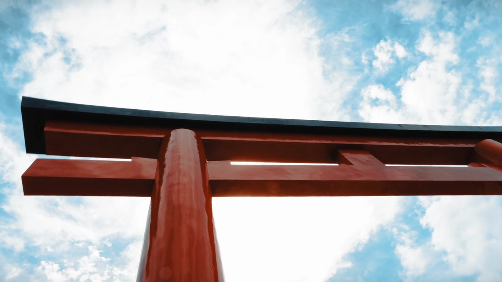 A torii gate against a blue sky